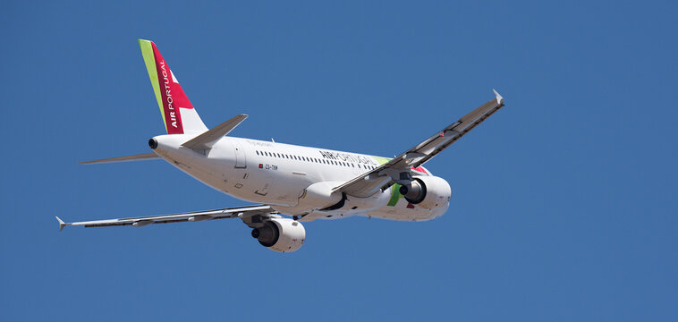 Tenerife, Spain august 29st, 2026. Airbus A320-214 TAP Air Portugal airlines, flies in the blue sky. Takeoff at Tenerife Airport. Retracting the landing gear.