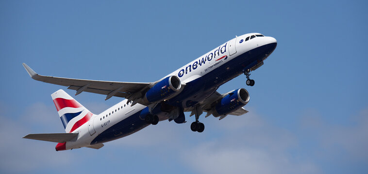 Tenerife, Spain august 29st, 2026. Airbus A320-232 British Airways (Oneworld Livery) airlines, flies in the blue sky. Takeoff at Tenerife Airport. Retracting the landing gear.