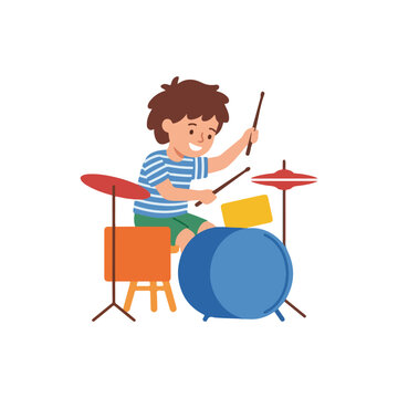 A happy young boy wearing a blue striped shirt enthusiastically plays a colorful drum set with drumsticks.
