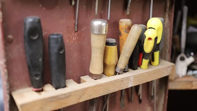 Tools arranged on a wall in a workshop