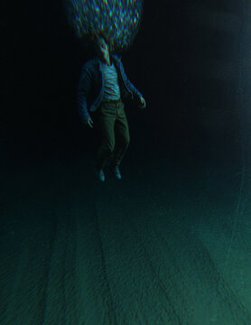 Middle aged man in casual wardrobe under water in ocean. 3D rendered still image.