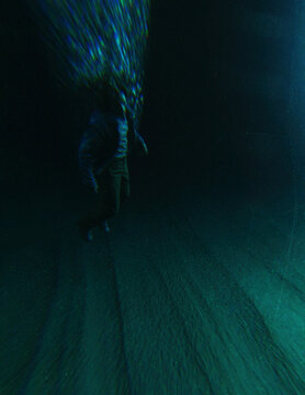 Middle aged man in casual wardrobe under water in ocean. 3D rendered still image.