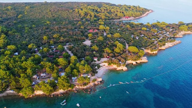 FKK Naturist Baldarin Campsite In Punta Kriza On Cres Island, Croatia, Aerial Drone Shot A Beautiful Summer Evening. Campervans, Motorhomes, Coastal Nature, Crystal Clear Adriatic Sea, Scenic Bays