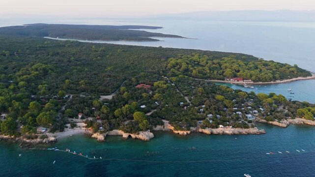 FKK Naturist Baldarin Campsite In Punta Kriza On Cres Island, Croatia, Aerial Drone Shot A Beautiful Summer Evening. Campervans, Motorhomes, Coastal Nature, Crystal Clear Adriatic Sea, Scenic Bays