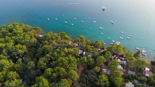 FKK Naturist Baldarin Campsite In Punta Kriza On Cres Island, Croatia, Aerial Drone Shot A Beautiful Summer Evening. Campervans, Motorhomes, Coastal Nature, Crystal Clear Adriatic Sea, Scenic Bays