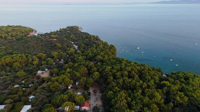 FKK Naturist Baldarin Campsite In Punta Kriza On Cres Island, Croatia, Aerial Drone Shot A Beautiful Summer Evening. Campervans, Motorhomes, Coastal Nature, Crystal Clear Adriatic Sea, Scenic Bays