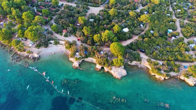 FKK Naturist Baldarin Campsite In Punta Kriza On Cres Island, Croatia, Aerial Drone Shot A Beautiful Summer Evening. Campervans, Motorhomes, Coastal Nature, Crystal Clear Adriatic Sea, Scenic Bays