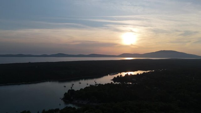FKK Naturist Baldarin Campsite In Punta Kriza On Cres Island, Croatia, Aerial Drone Shot A Peaceful Beach At Sunset, Campervans, Motorhomes, Coastal Nature, Crystal Clear Adriatic Sea, Scenic Bays