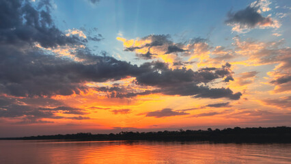 Obraz premium sunset over the river