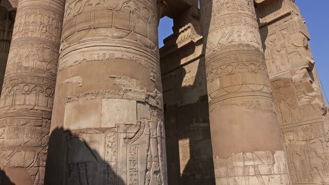 View of ancient temple columns with intricate hieroglyphs at the Temple of Kom Ombo in Aswan, Aswan Governorate, Egypt.