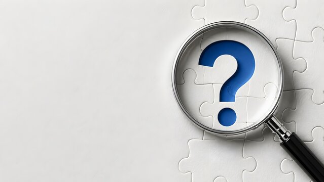 Minimalist concept of problem solving showing a magnifying glass revealing a blue question mark on a white jigsaw puzzle background