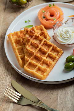 Crunchy waffle fries with sour cream dip served in a basket