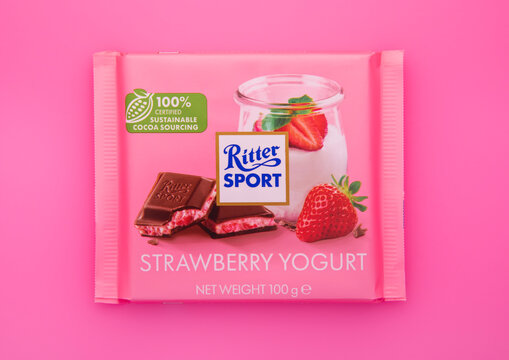 LONDON, UK - FEBRUARY 21, 2025: Ritter Sport chocolate bar with strawberry yogurt flavour on pink background.Product by Germany.