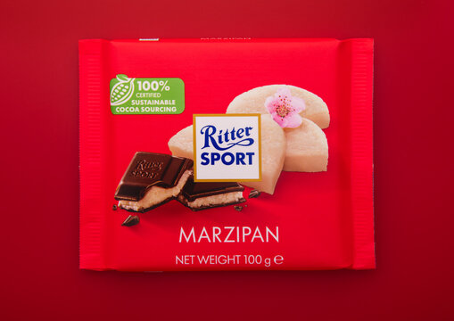 LONDON, UK - FEBRUARY 11, 2025: Ritter Sport chocolate bar with marzipan on red background.