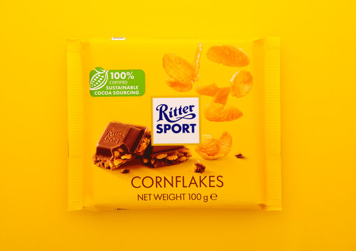 LONDON, UK - DECEMBER 24, 2024: Chocolate bar by Ritter Sport with cornflakes on yellow background.