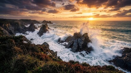 Fototapeta premium Jagged coastal cliffs and crashing waves during a golden sunset