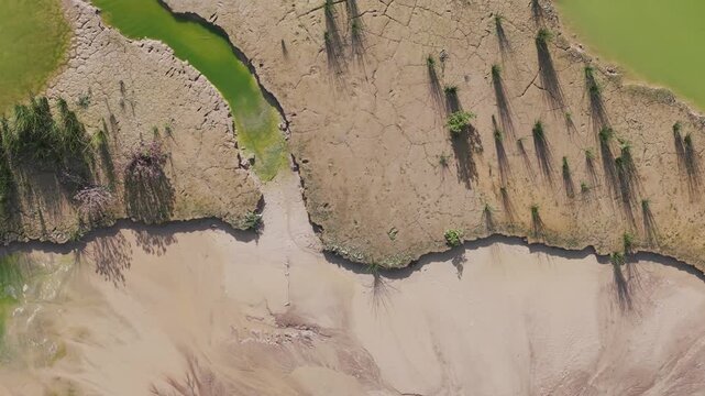 Lysterfield, Victoria, Australia - 27 August 2026: Aerial view of Boral Quarries showing dry cracked earth and muddy water.