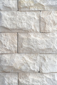 High quality limestone, quartzite, or sandstone, cut into blocks featuring a natural, rough hewn surface. 