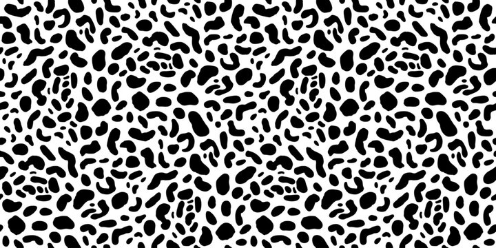 Dense black and white animal spot pattern with organic irregular markings, creating a bold high-contrast fur texture for fashion. Vector illustration