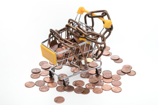 Chained Shopping Cart with Coins Symbolizing Debt and Spending Control