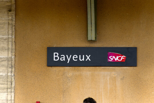 Close-up of sign at platform of railway station at French city of Bayeux on a summer day. Photo taken July 15th, 2026, Caen, Normandie, France.