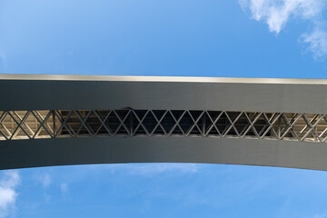 Naklejka premium A detailed close-up of the lower truss structure of the concrete Infante Bridge in Porto.