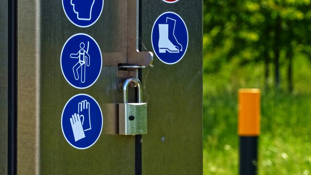 24 May 2026, Alfeld, Lower Saxony, Germany - Industrial Safety Door Padlock Signs 