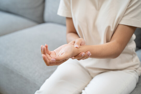 Close-up shot of human hands suffering from ligament inflammation on the palm.