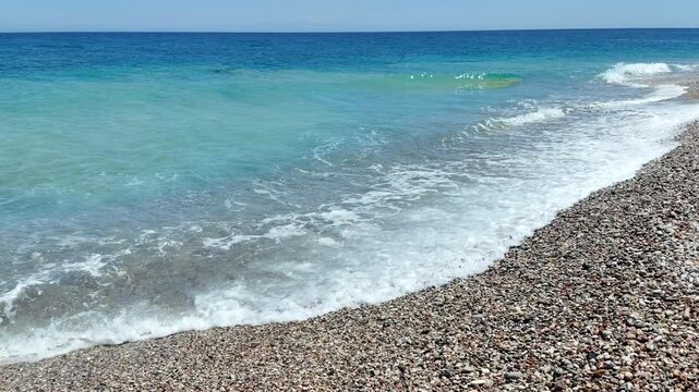 Paralia Enidriou Beach in Rhodes town in Greece. Rhodes coast landscape in sunny weather. Greek Island.