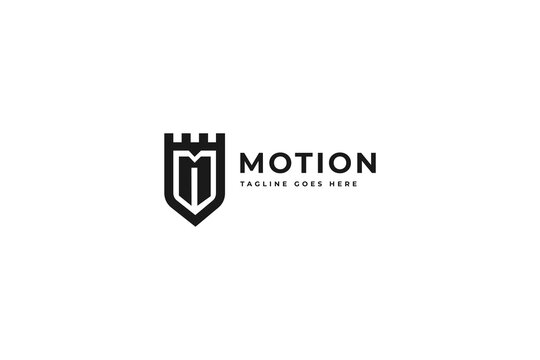 Minimalist logo design featuring a castle shield emblem with letter M and bold typography for corporate brand identity presentation