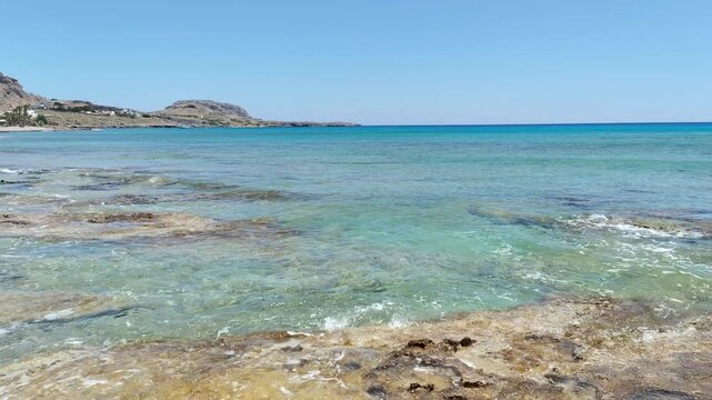 Rhodes island vacation in Greece. Navarone Bay beach landscape in sunny weather in Lindos.