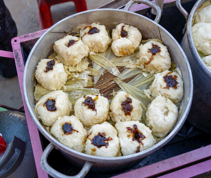 Traditional otongo made with oca in the Peruvian Andes. Handmade regional food is steamed on corn husks and served from a rustic cooking pot.