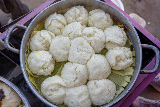Traditional otongo from the Peruvian Andes served in a cooking pot. Handmade oca specialty rests on corn husks in a regional Andean preparation.