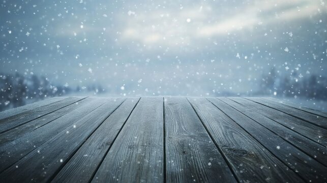 Empty Wooden Table Surface Under Falling Snow in Winter Landscape