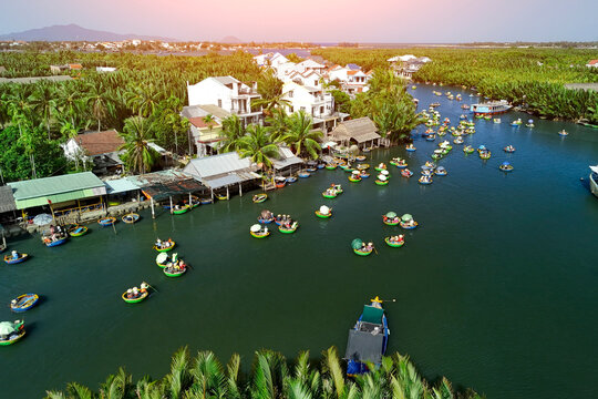 Aerial view, tourists from relax and experiencing basket boat tour at the coconut water mangrove palm forest in Cam Thanh village, Hoi An, Quang Nam Da Nang, Vietnam
