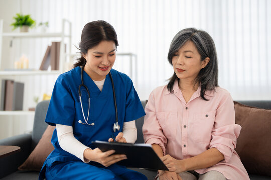 Professional doctor consulting senior patient at home . medical care visit. talking providing medical assistance. Elderly people home care concept.