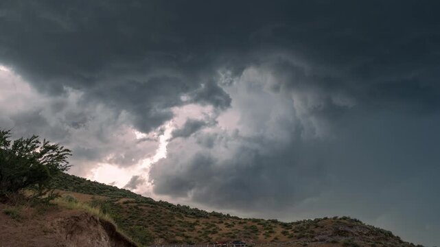 View of stormy dark clouds over the hills near Lucky Peak Lake in Ada County, Idaho, United States.
