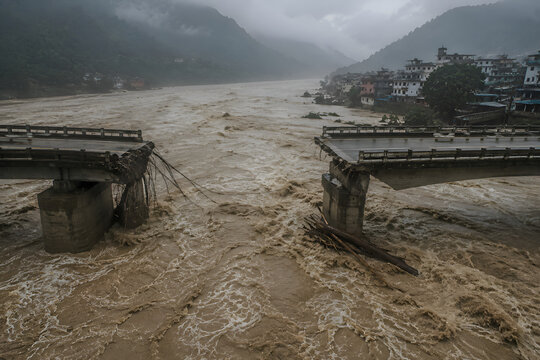 Devastating Nepal Flood with Collapsed Bridge and Raging River in Mountain Valley