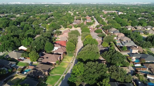 Paved residential streets extend past Mockingbird Lane within quiet North Texas tracts. Emerald lawns surround brick homesteads across established subdivisions in Coppell, Texas