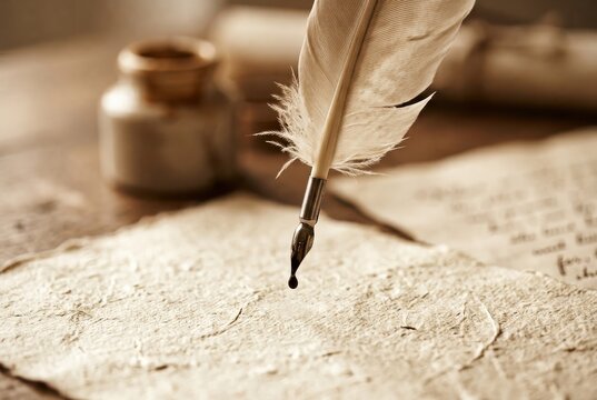 Vintage writing quill pen on parchment for calligraphy and manuscript design
