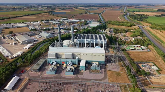 Aerial view of gas turbine power station building and electrical substation in Spalding UK