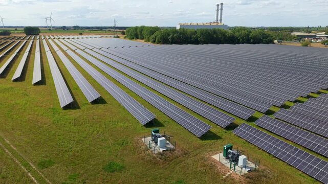 Aerial view of vast solar farm and Sutton Bridge gas power station in rural Lincolnshire UK