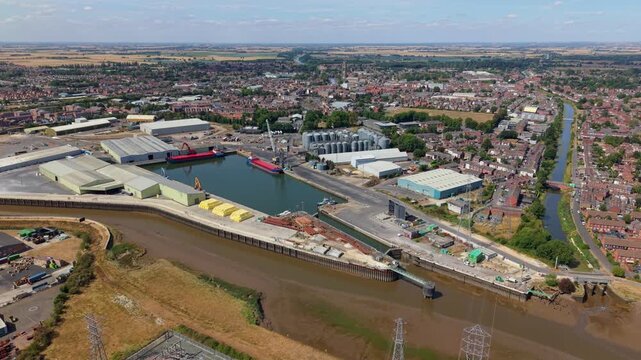 Aerial view of commercial cargo port and ships docked on River Witham in Boston Lincolnshire UK