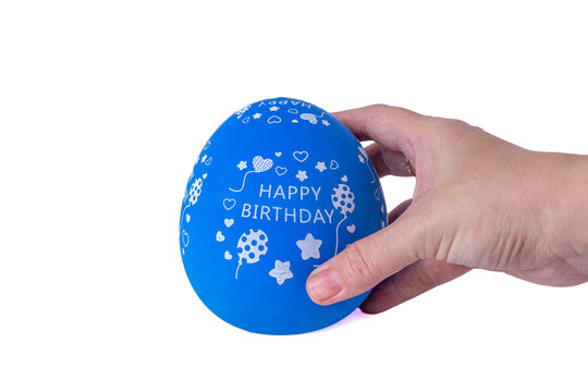 Hand holding a blue egg shaped kitchen timer isolated on white background