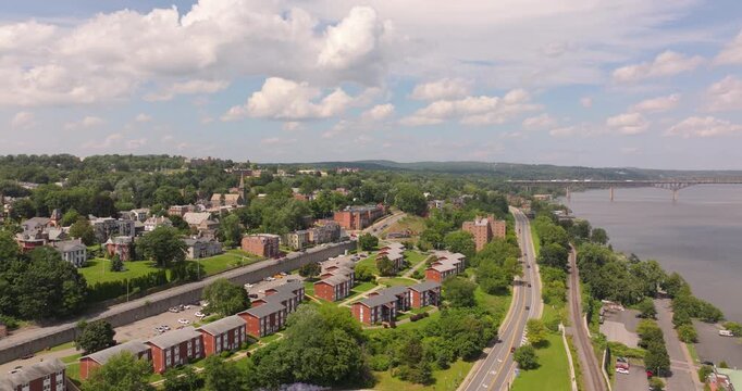 Newburgh riverfront pan with houses, college, marina and bridge in New York