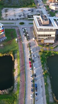 Artificial Lake Integrated with Modern Technology Buildings and Green Infrastructure in Florian&oacute;polis, Brazil. Establishing Shot. Aerial View.