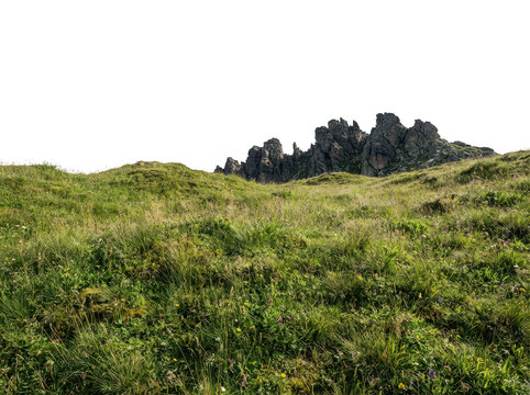 A serene landscape featuring lush green grass rolling hills vibrant wildflowers and jagged rocky outcrops under clear sky transparent background