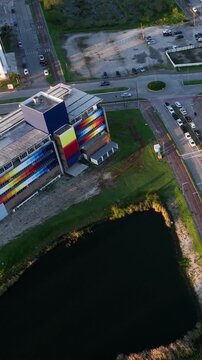 Artificial Lake Integrated with Modern Technology Buildings and Green Infrastructure in Florian&oacute;polis, Brazil. Establishing Shot. Aerial View.