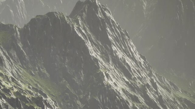 The scene shows high mountains with steep rocky surfaces under daylight. Green patches are visible among the rocks. The landscape appears rugged and uneven.