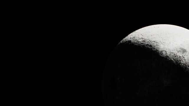 The scene shows the surface of the moon against a dark background. The moon is partially lit, revealing craters and shadows. This takes place during a clear night in space.